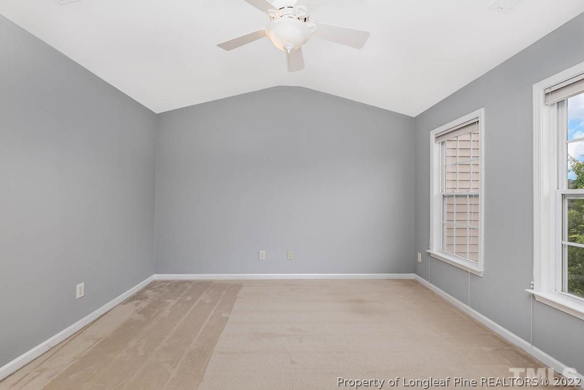 5441 Golden Arrow Lane Raleigh, NC 27613 - Photo 19 of 26 an empty room with windows and entrance
