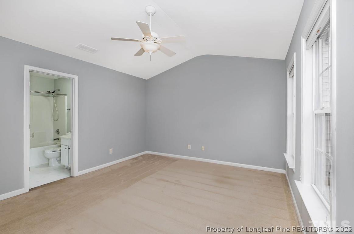5441 Golden Arrow Lane Raleigh, NC 27613 - Photo 20 of 26 a view of an empty room with a fan