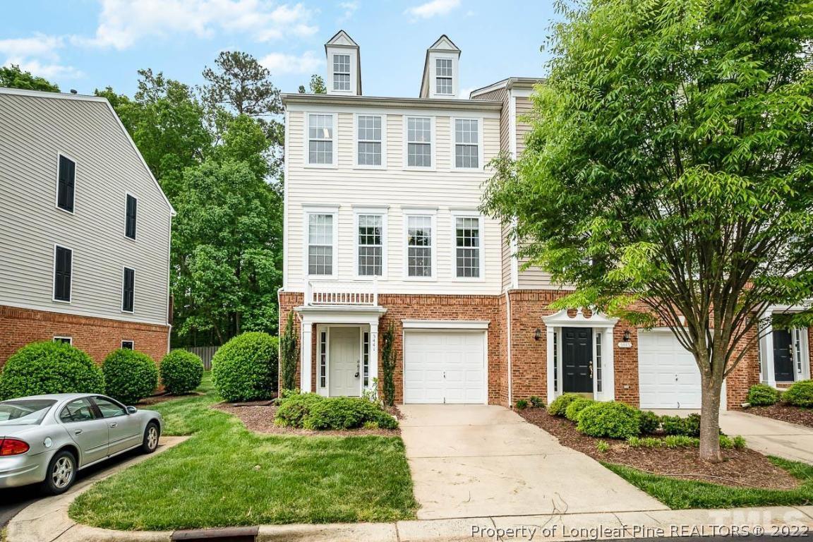 5441 Golden Arrow Lane Raleigh, NC 27613 - Photo 2 of 26 a front view of a house with a yard and trees