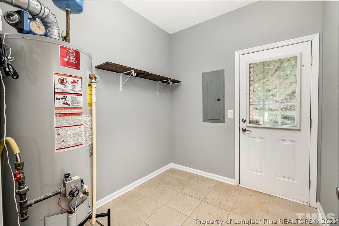 5441 Golden Arrow Lane Raleigh, NC 27613 - Photo 25 of 26 a view of walk in closet with clothes and shoes