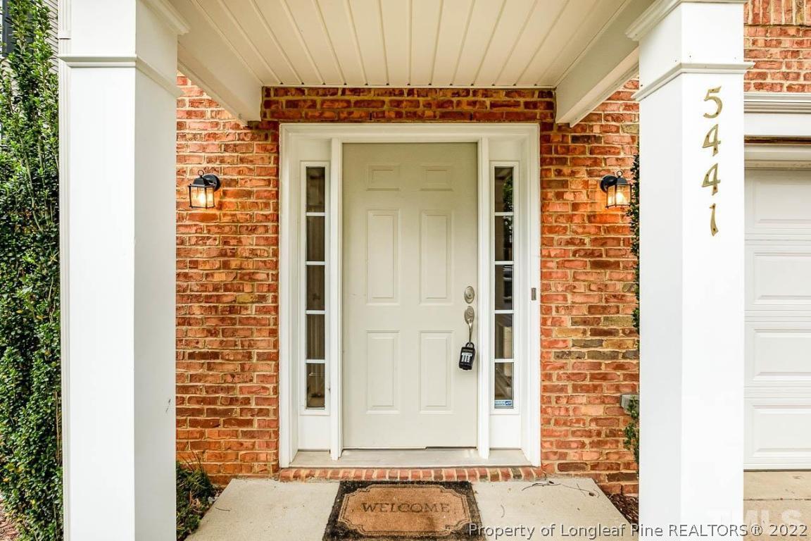 5441 Golden Arrow Lane Raleigh, NC 27613 - Photo 6 of 26 a front view of a building with a shower