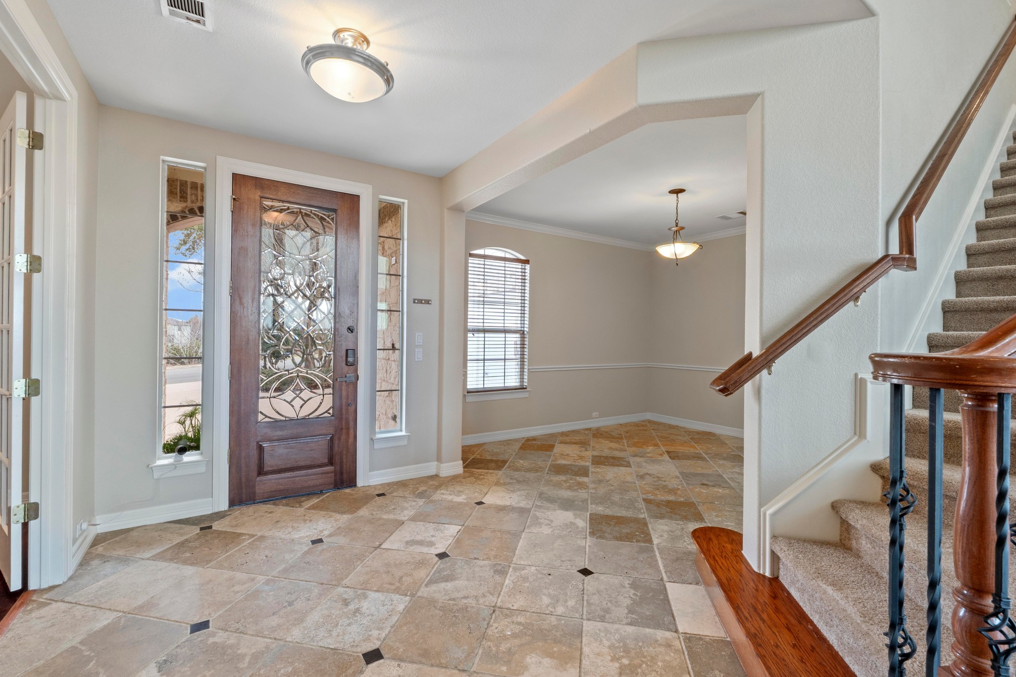 7204 Covered Bridge Drive Austin, TX 78736 - Photo 10 of 40 Entry foyer with a peek into the dedicated formal dining room.