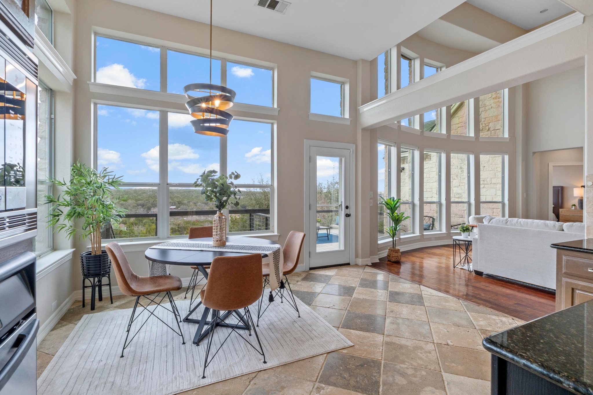 7204 Covered Bridge Drive Austin, TX 78736 - Photo 9 of 40 A wall of windows makes living in this home a joy while taking in the breathtaking views.