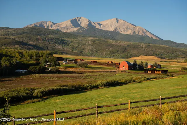 a view of an ocean with a mountain