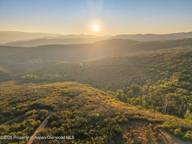 a view of an ocean with a mountain