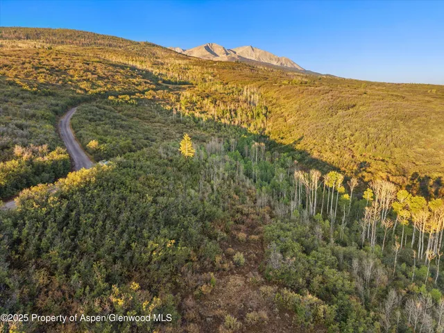a view of an ocean and a mountain
