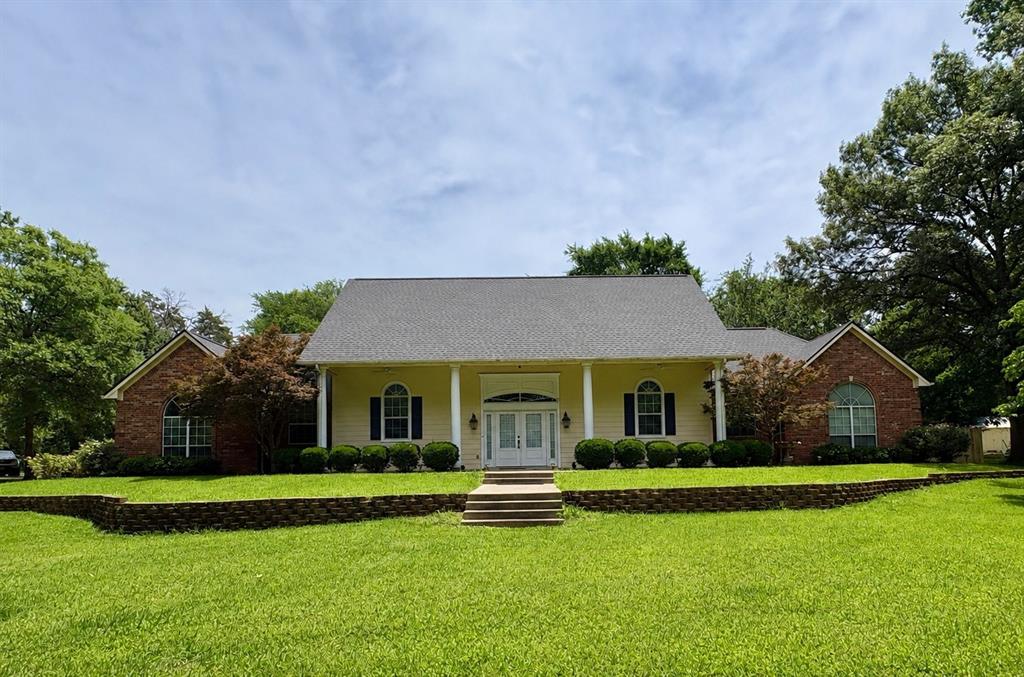 875 Arnold Paul Road Canton, TX 75103 - Photo 1 of 32 a view of a house with a garden and yard