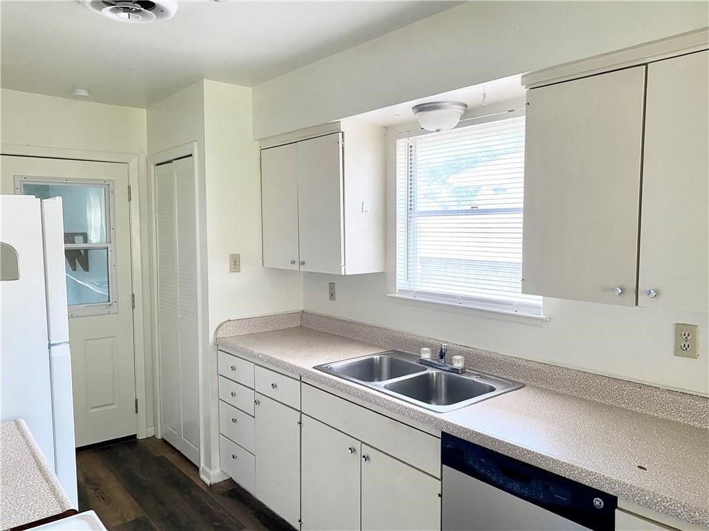 1728 Denver Street Portland, TX 78374 - Photo 12 of 15 a view of a kitchen with a sink and dishwasher next to a window