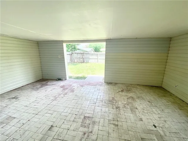 a view of an empty room and window