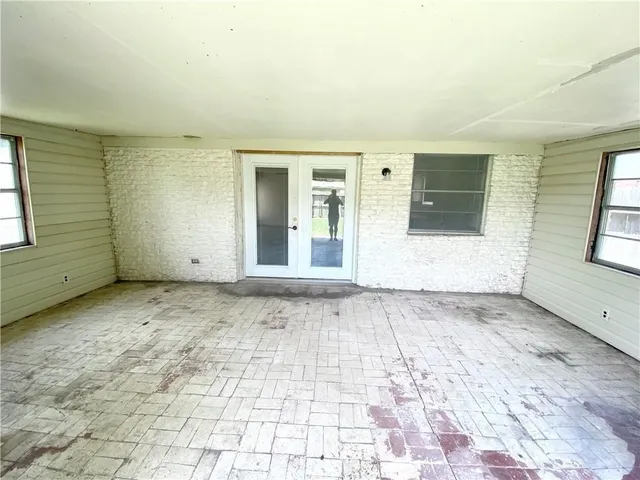 an empty room with windows