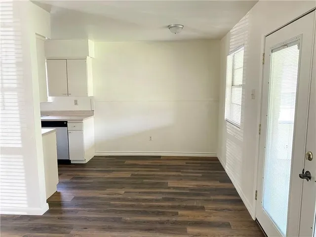 a view of a room with wooden floor and staircase