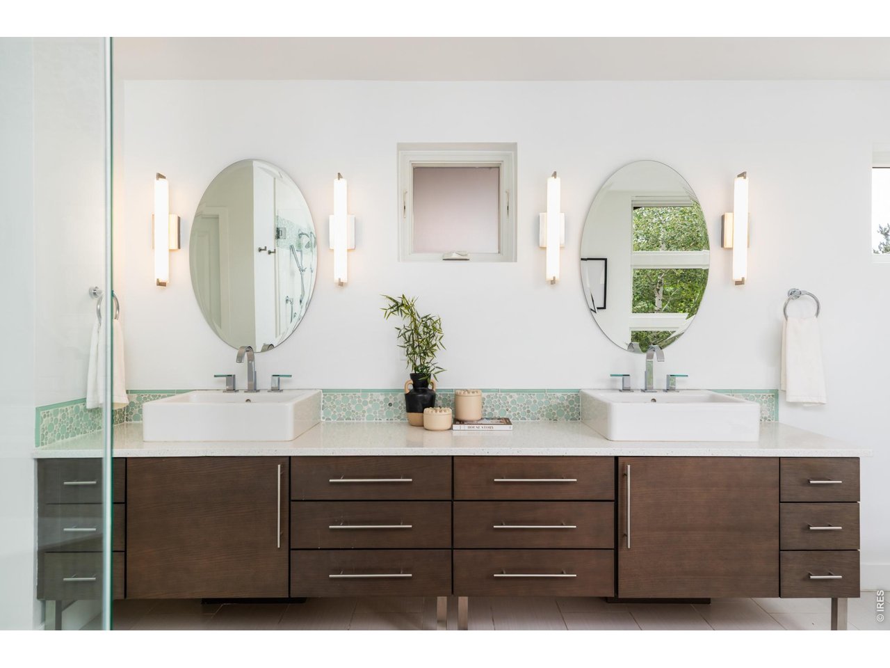 3963 Springleaf Lane Boulder, CO 80304 - Photo 14 of 32 The five-piece bathroom is filled with natural light and features a soaking tub surrounded by large windows, a shower with dual shower heads, a large double vanity, and a private water closet.