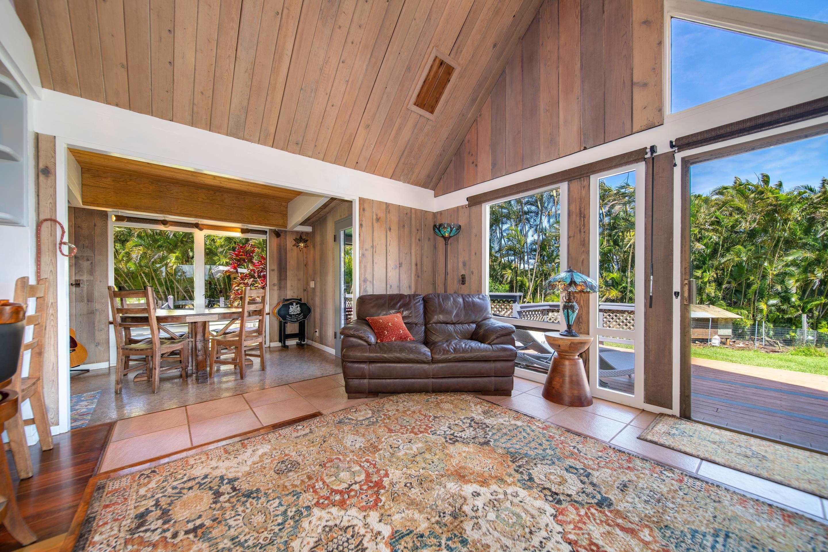 55 Oluolumau Place Haiku, HI 96708 - Photo 12 of 30 a living room with furniture and a large window