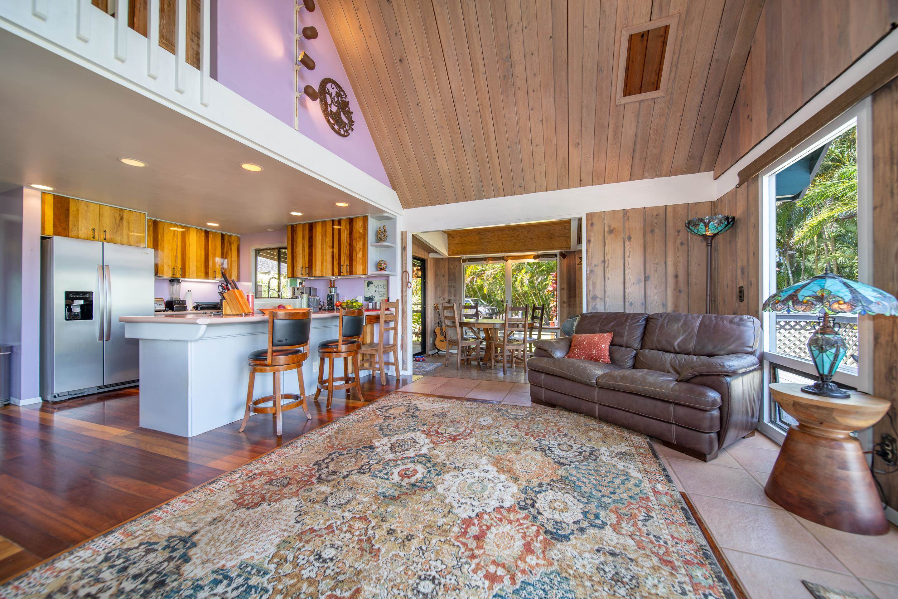55 Oluolumau Place Haiku, HI 96708 - Photo 14 of 30 a living room with furniture and a large window