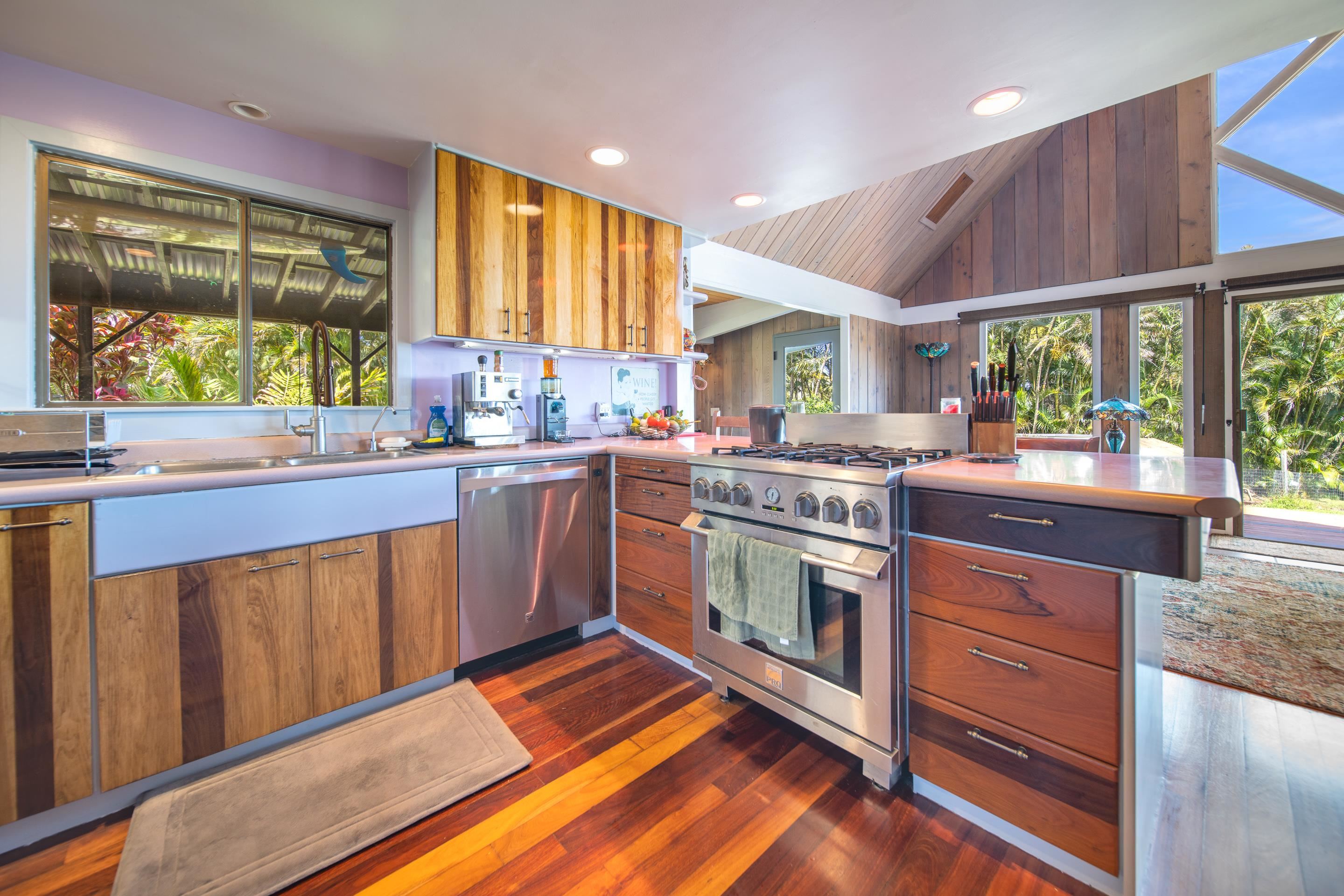 55 Oluolumau Place Haiku, HI 96708 - Photo 18 of 30 a kitchen with a stove a sink and a refrigerator
