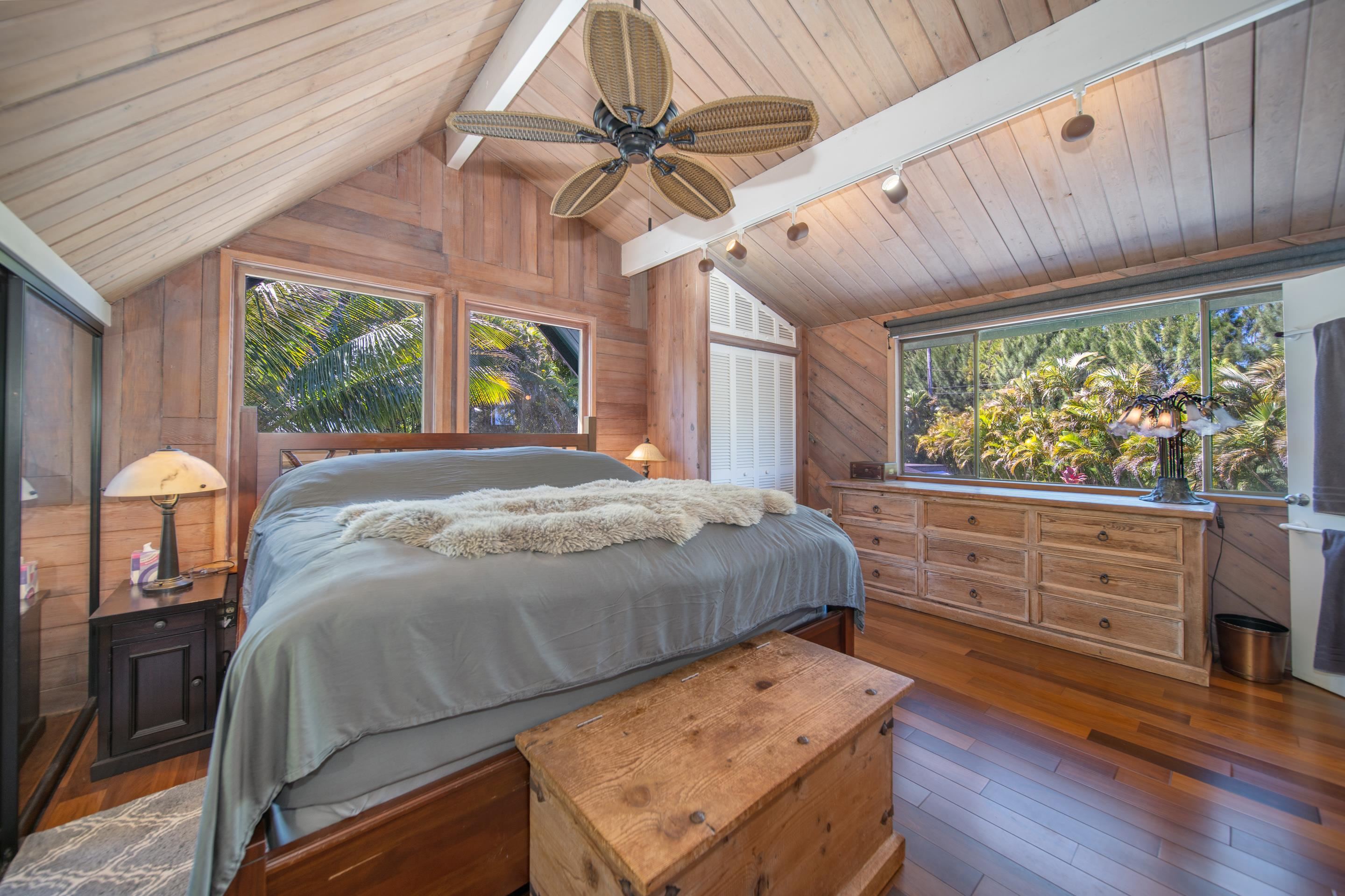 55 Oluolumau Place Haiku, HI 96708 - Photo 20 of 30 a bed sitting in a bedroom next to a window