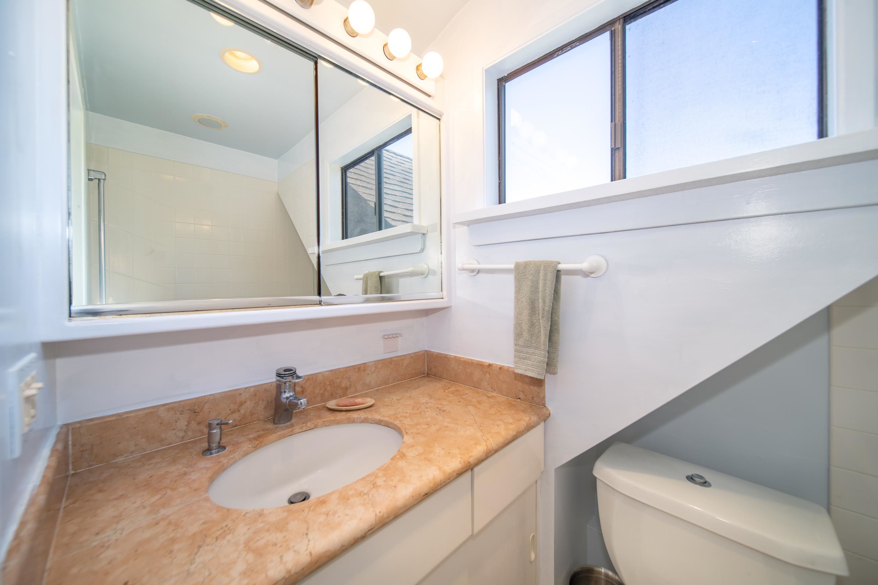 55 Oluolumau Place Haiku, HI 96708 - Photo 21 of 30 a bathroom with a sink and a mirror