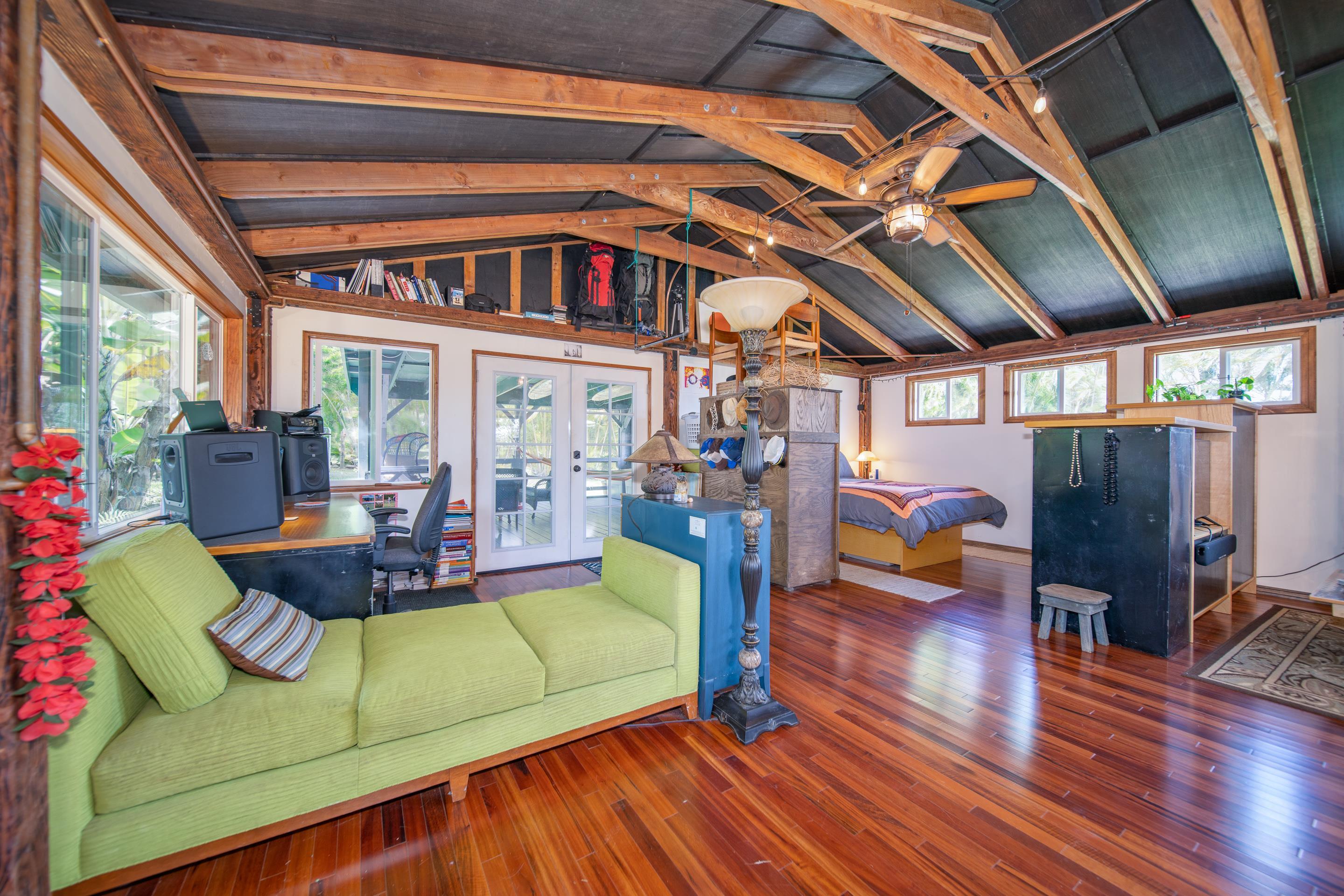 55 Oluolumau Place Haiku, HI 96708 - Photo 27 of 30 a living room with furniture and a large window