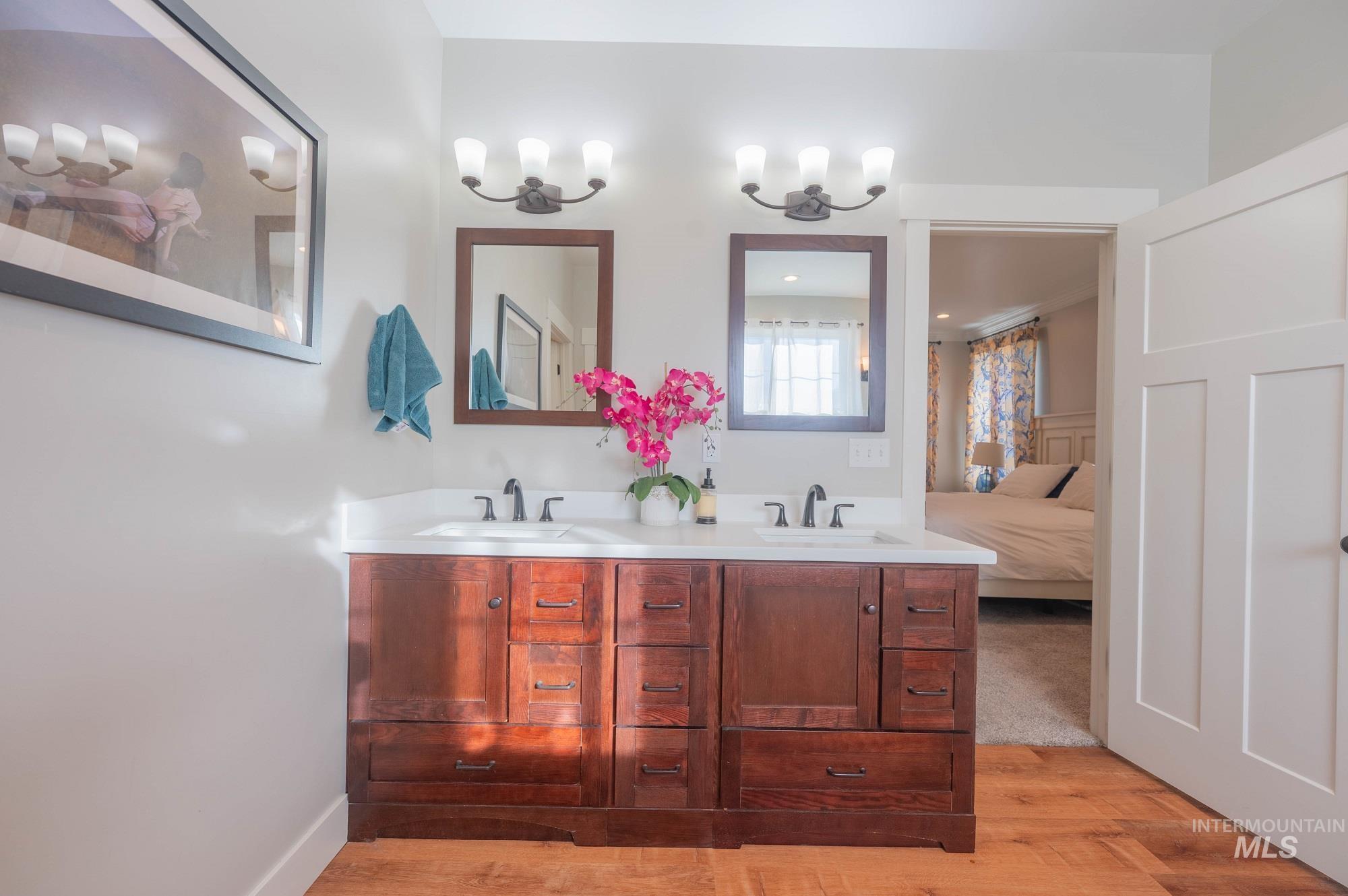 515 School Street Albion, ID 83311 - Photo 15 of 30 Full bathroom featuring double vanity, connected bathroom, and light wood-style floors