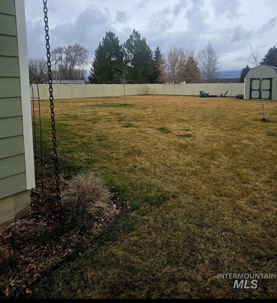515 School Street Albion, ID 83311 - Photo 28 of 30 Fenced backyard featuring a storage unit