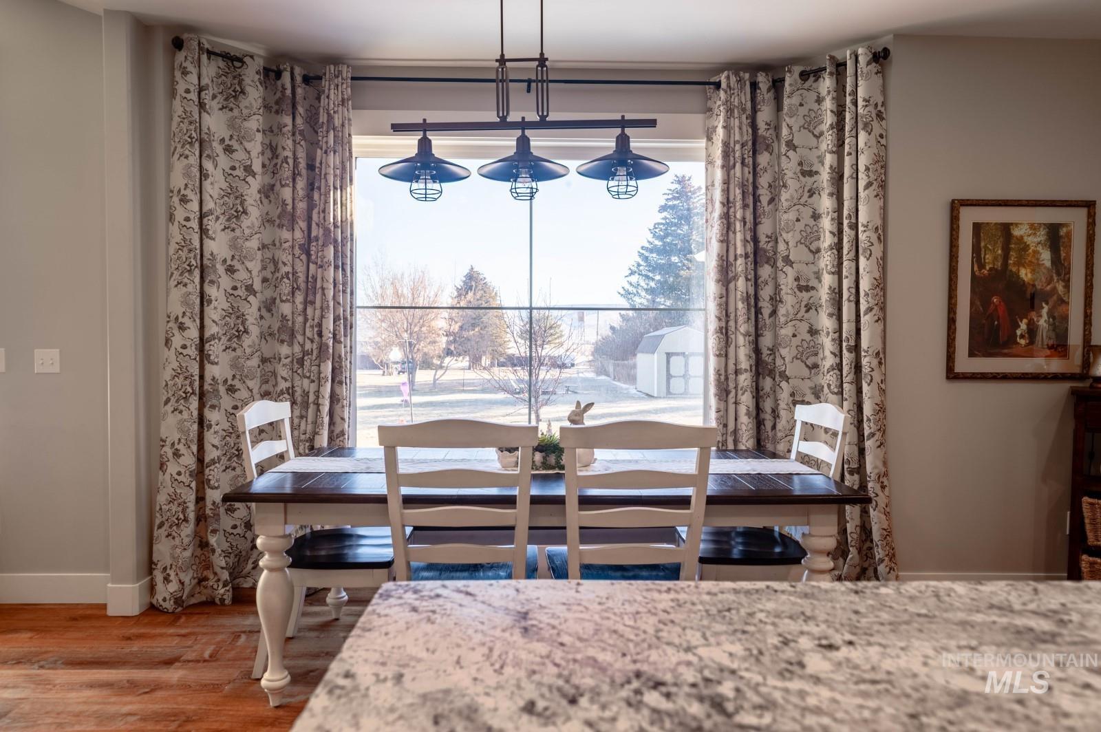 515 School Street Albion, ID 83311 - Photo 6 of 30 Dining space with plenty of natural light and wood finished floors