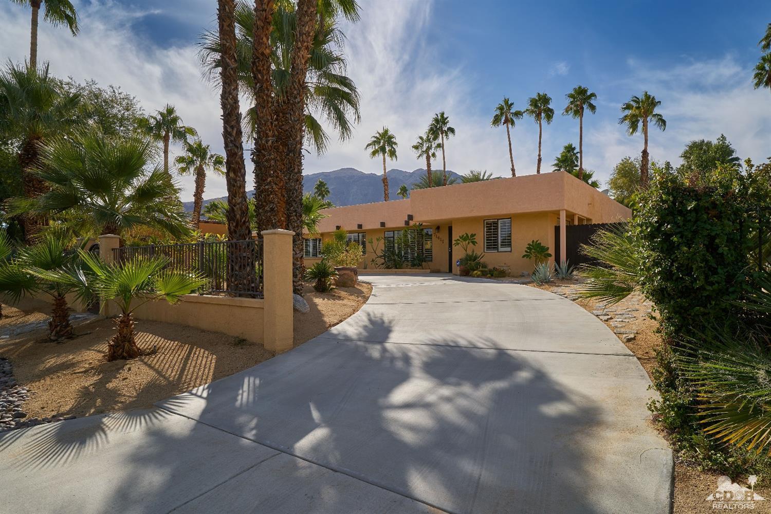 71417 Mirage Road Rancho Mirage, CA 92270 - Photo 12 of 25 a view of a house with a yard and palm tree