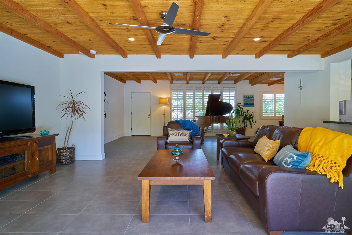 71417 Mirage Road Rancho Mirage, CA 92270 - Photo 13 of 25 a living room with furniture and a flat screen tv
