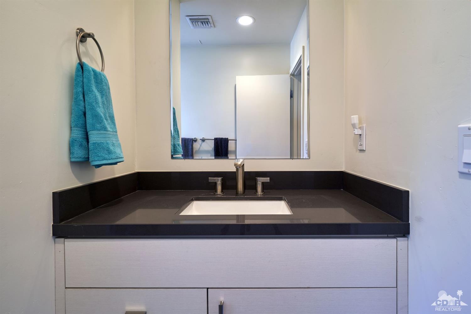 71417 Mirage Road Rancho Mirage, CA 92270 - Photo 23 of 25 a bathroom with a sink and a mirror