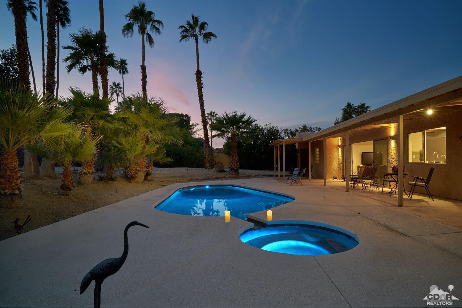 71417 Mirage Road Rancho Mirage, CA 92270 - Photo 10 of 25 a view of a swimming pool with a table and chairs