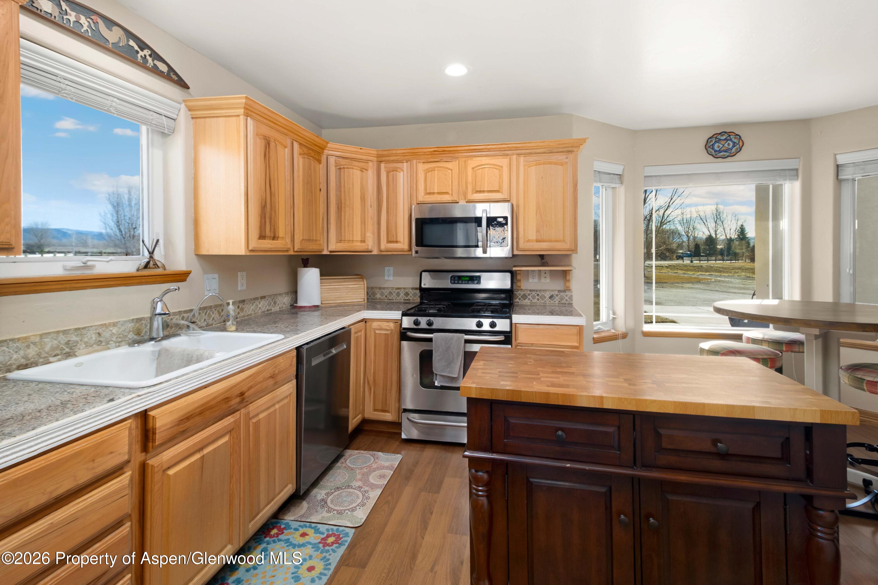 83 Native Springs Drive Rifle, CO 81650 - Photo 11 of 31 a kitchen with a stove a sink and a window