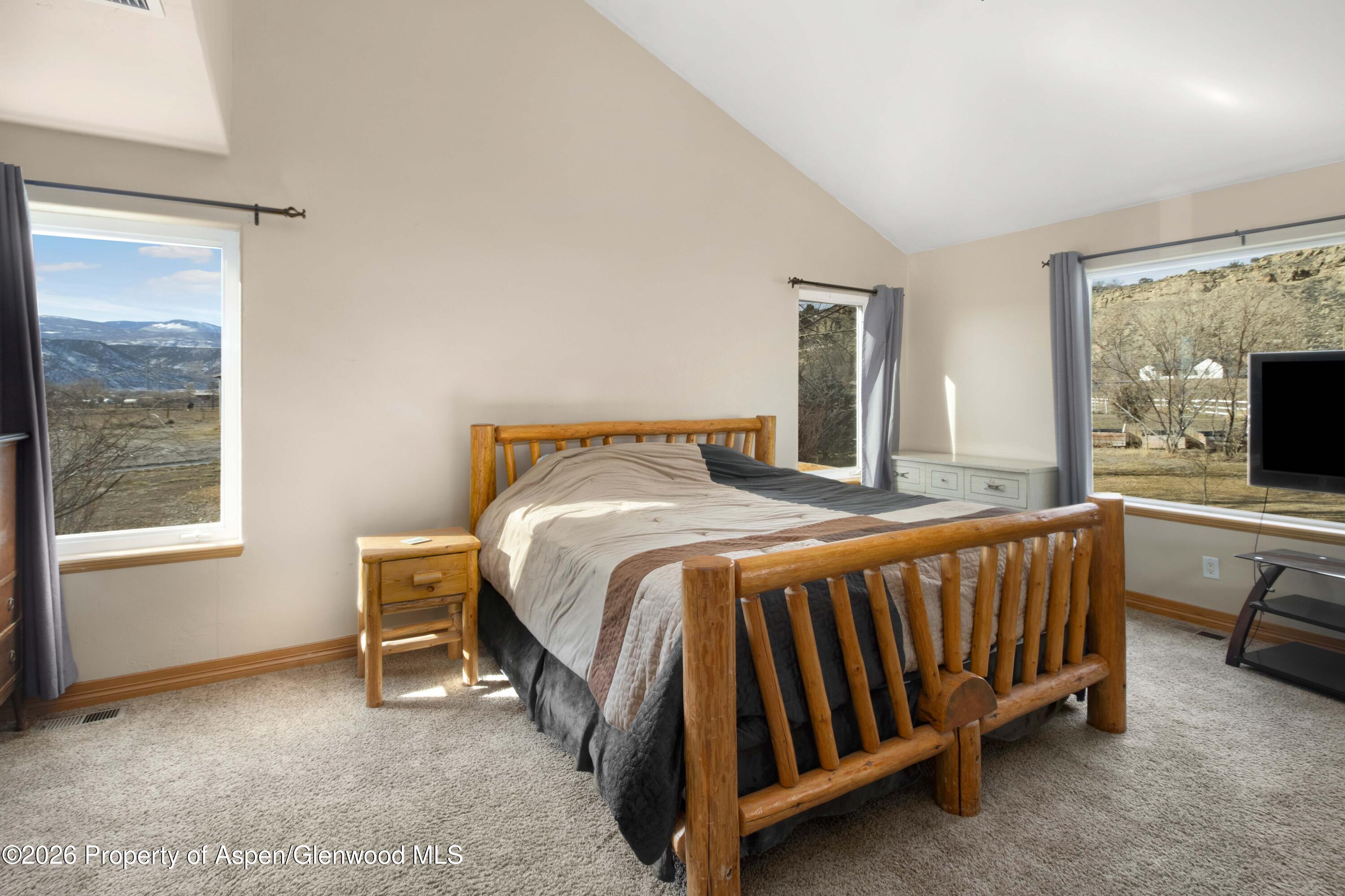 83 Native Springs Drive Rifle, CO 81650 - Photo 12 of 31 a bedroom with a bed and window
