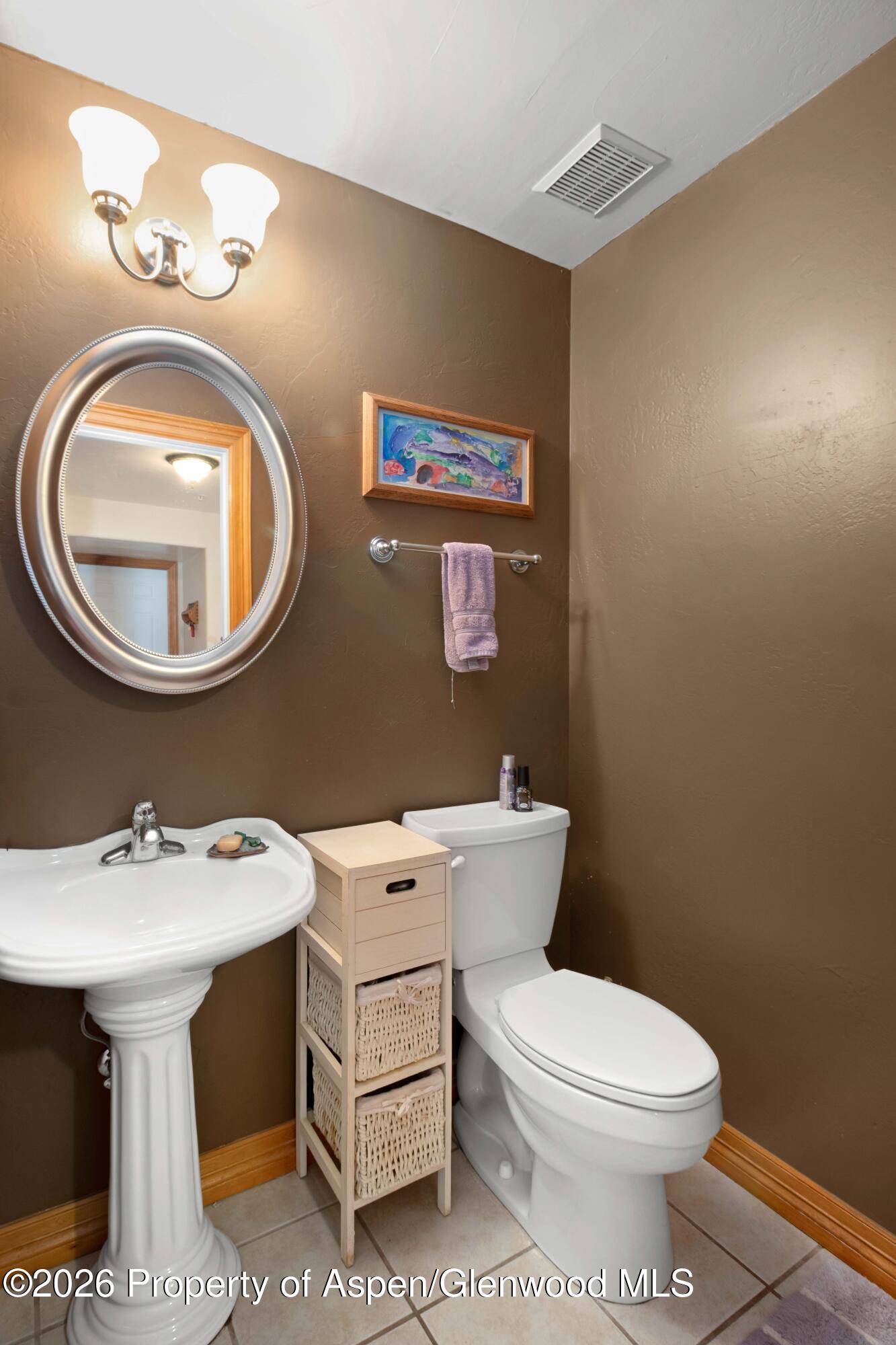 83 Native Springs Drive Rifle, CO 81650 - Photo 21 of 31 a bathroom with a sink mirror and toilet