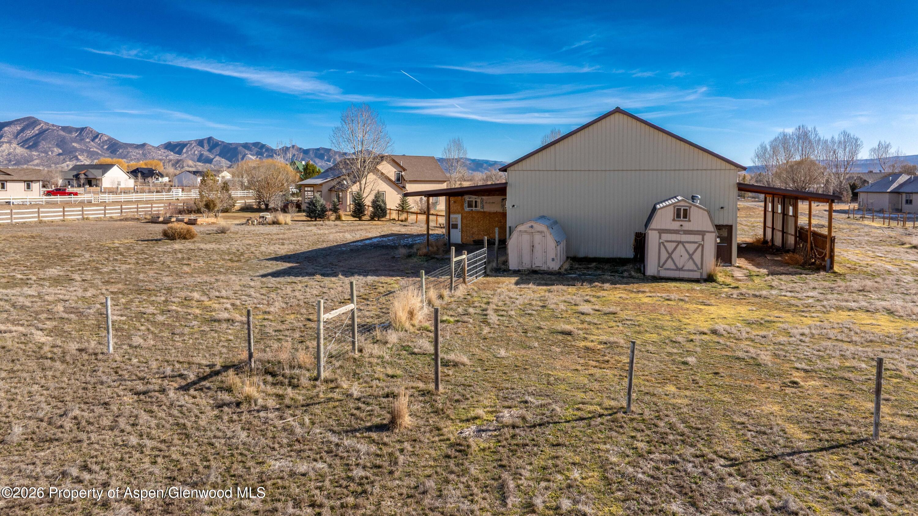 83 Native Springs Drive Rifle, CO 81650 - Photo 27 of 31 a view of a house with a yard