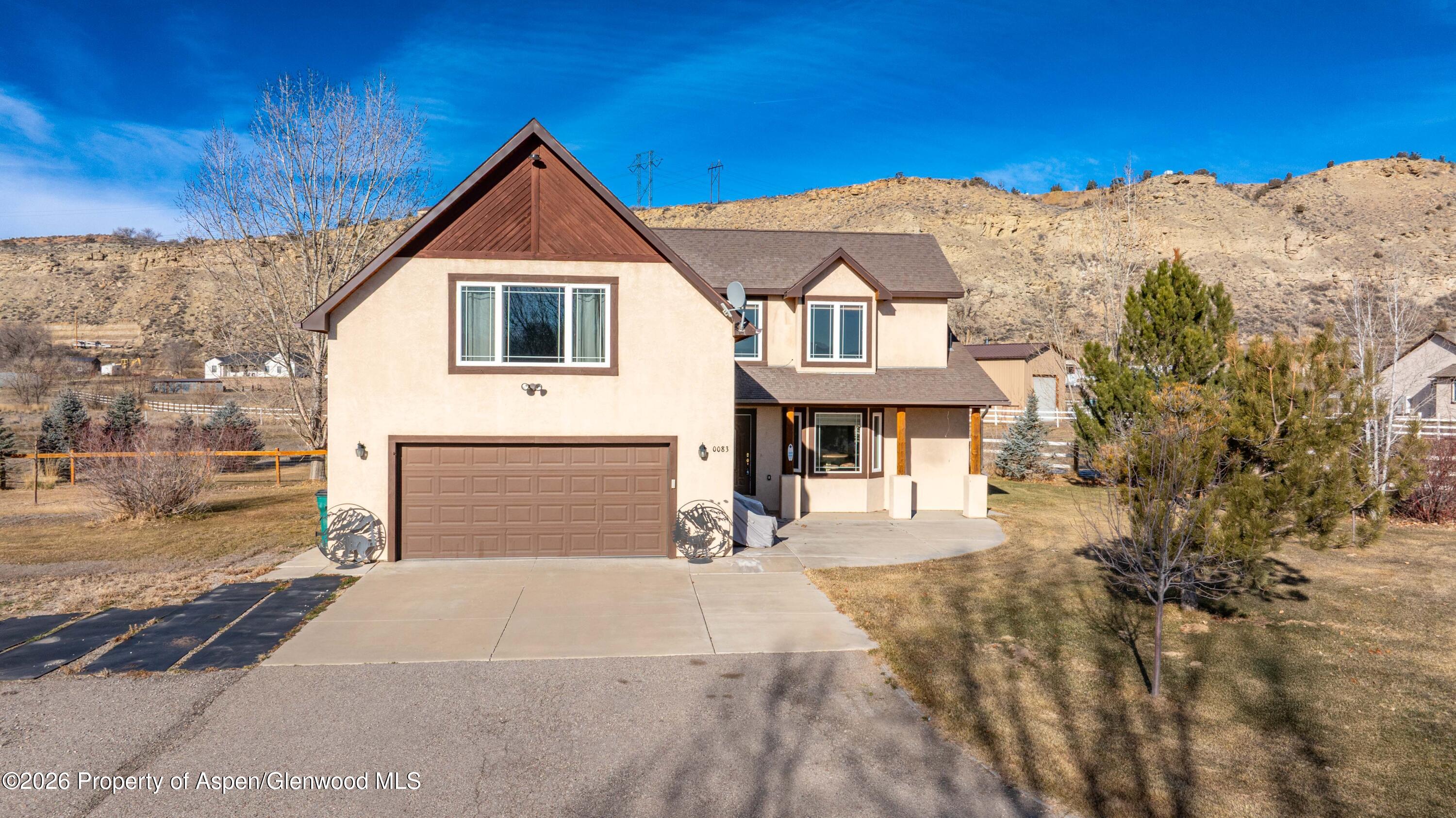 83 Native Springs Drive Rifle, CO 81650 - Photo 29 of 31 a front view of a house with a yard