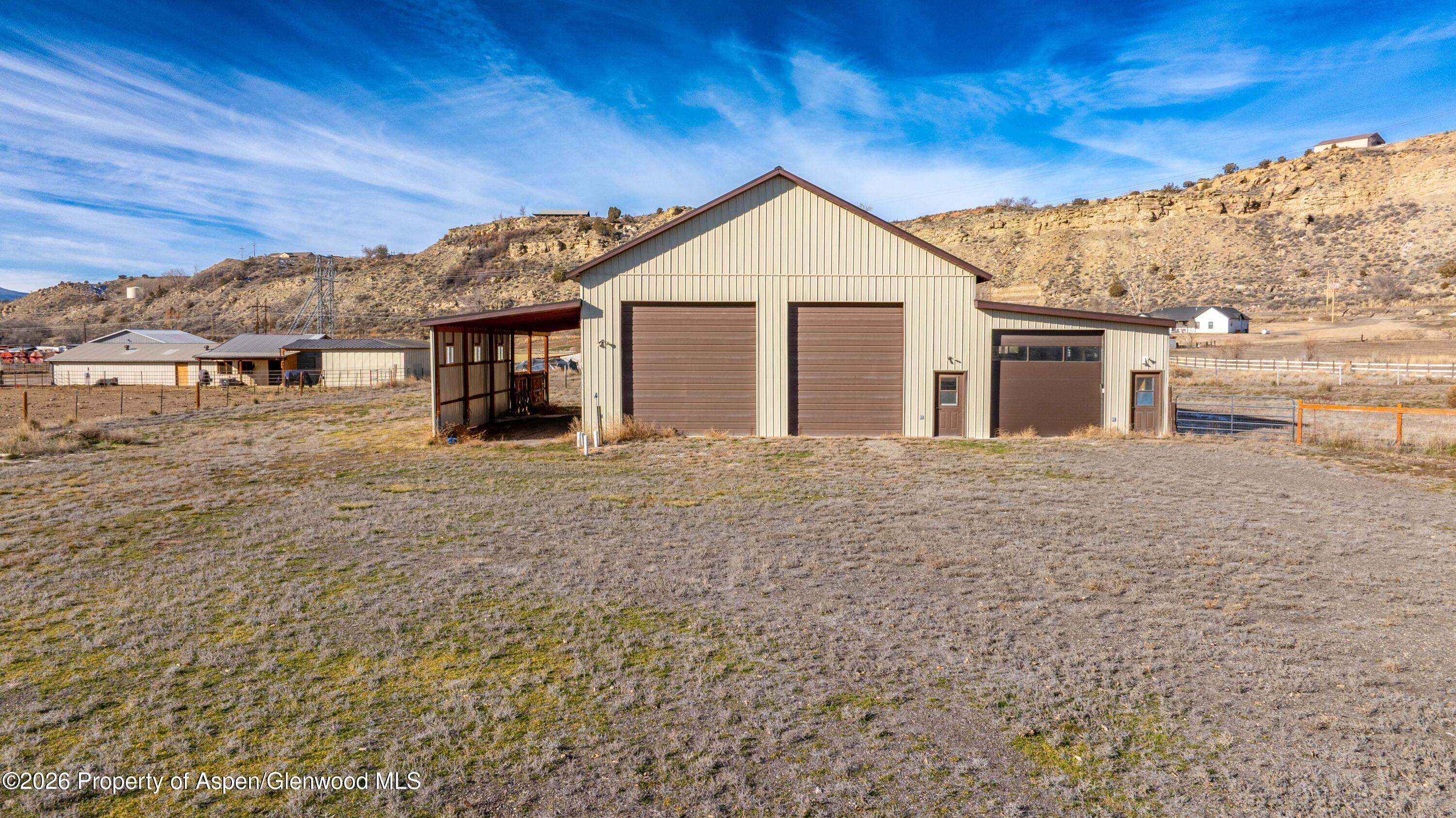 83 Native Springs Drive Rifle, CO 81650 - Photo 6 of 31 a view of a house with a yard