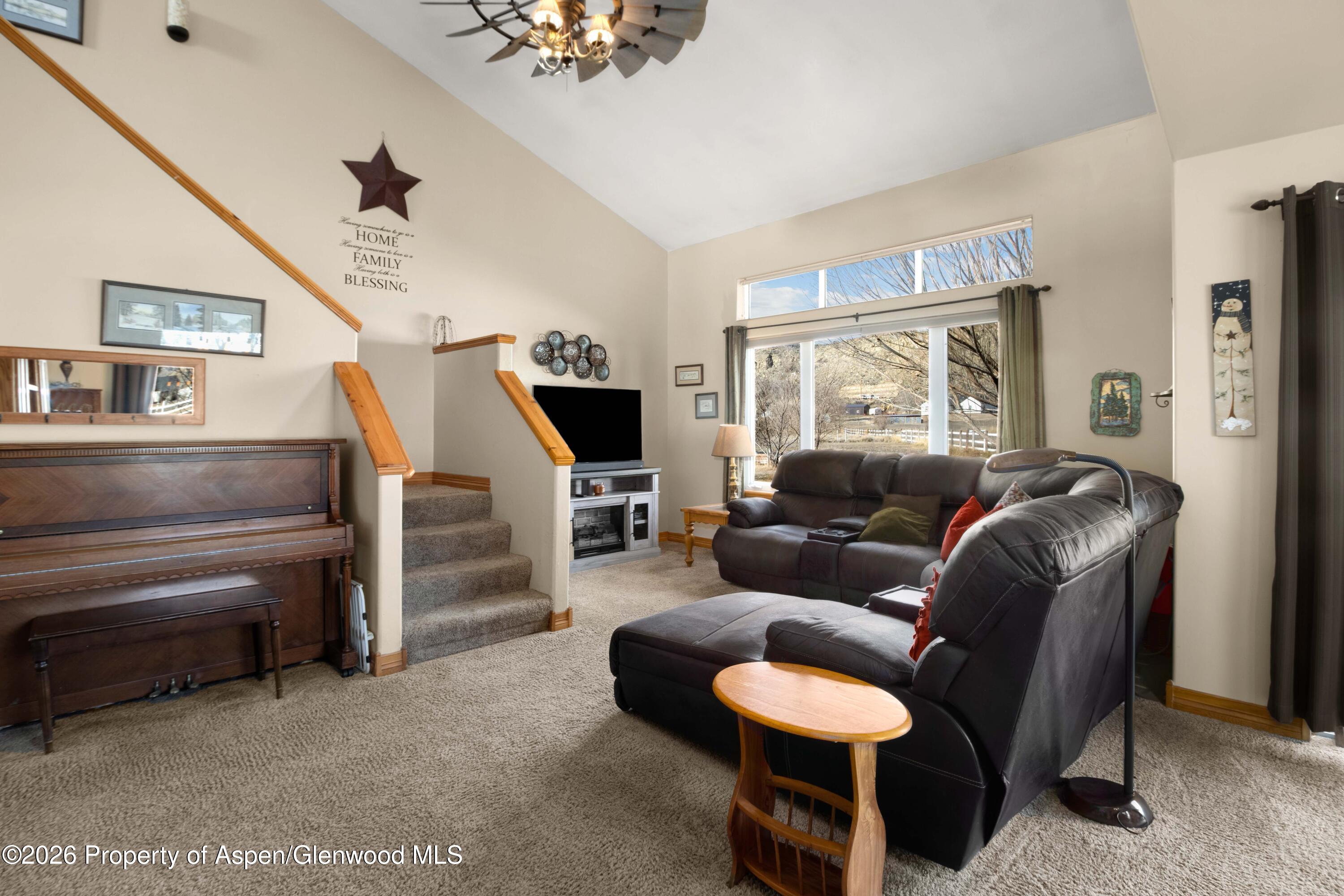 83 Native Springs Drive Rifle, CO 81650 - Photo 8 of 31 a living room with furniture and a flat screen tv