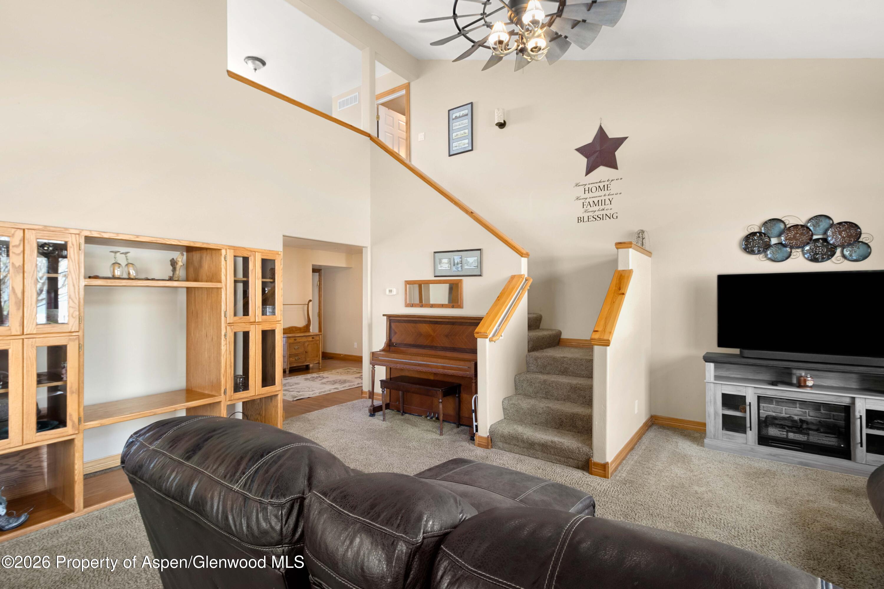 83 Native Springs Drive Rifle, CO 81650 - Photo 9 of 31 a living room with furniture and a flat screen tv