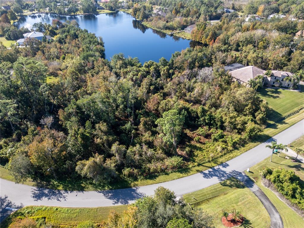 3839 Rambling Acres Drive Titusville, FL 32796 - Photo 5 of 8 an aerial view of residential houses with outdoor space