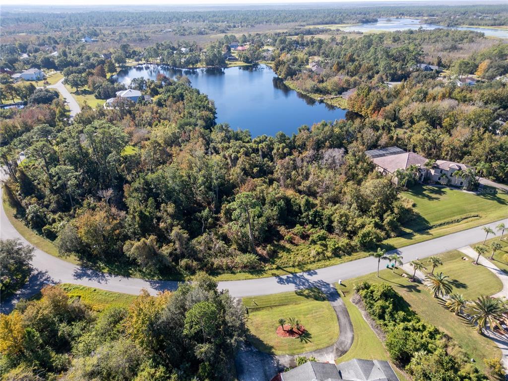 3839 Rambling Acres Drive Titusville, FL 32796 - Photo 7 of 8 an aerial view of residential houses with outdoor space