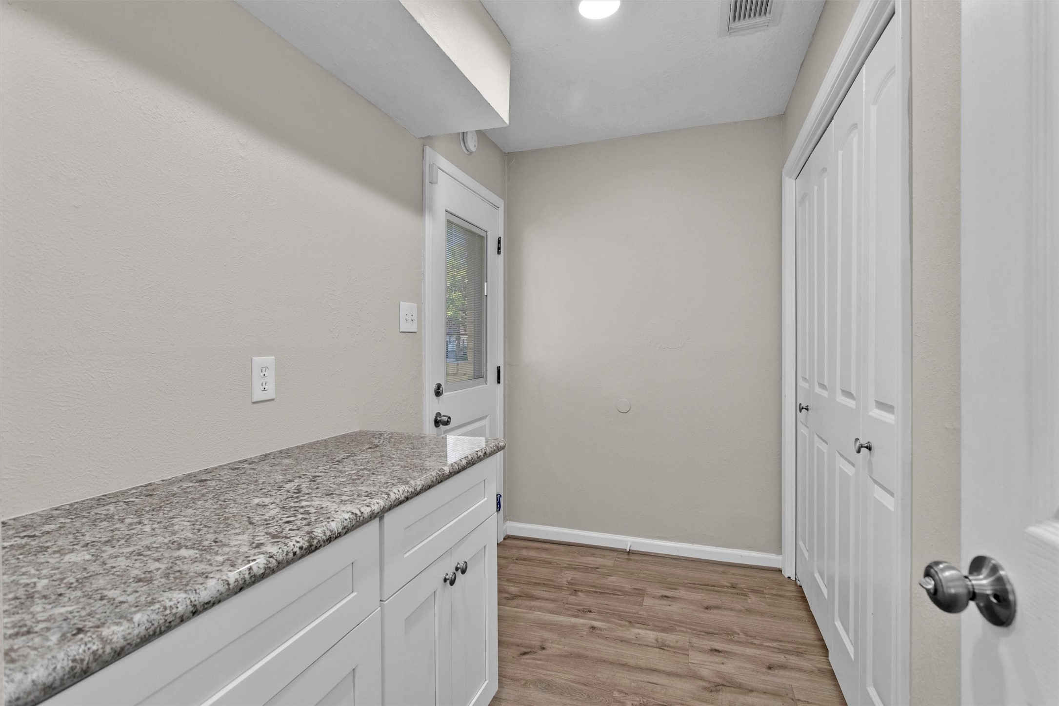 9115 Godstone Lane Spring, TX 77379 - Photo 18 of 46 This hallway leads to the garage facing back door.