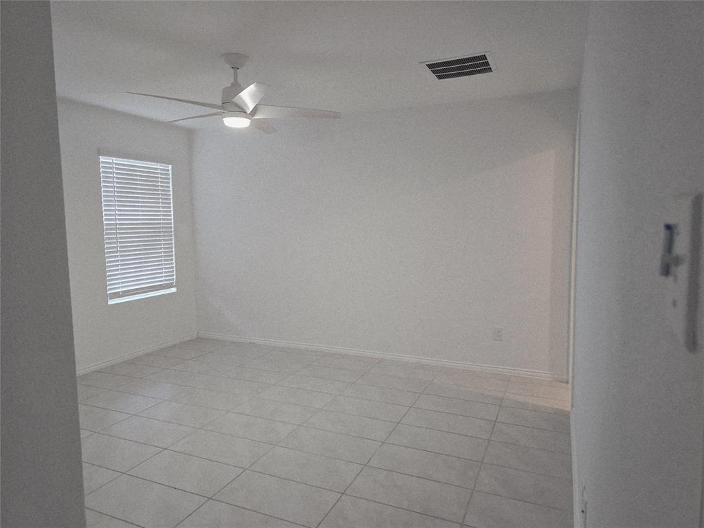 14017 Ilderton Street Pilot Point, TX 76258 - Photo 11 of 22 a view of an empty room with a window