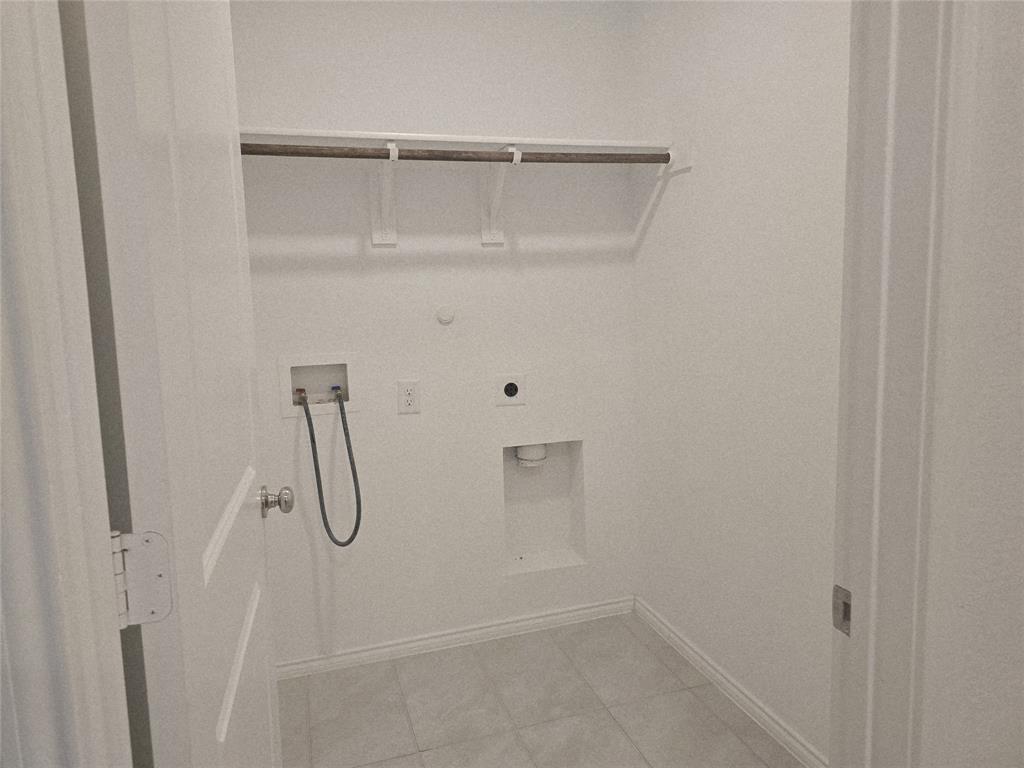 14017 Ilderton Street Pilot Point, TX 76258 - Photo 15 of 22 a view of small space with racks on the wall