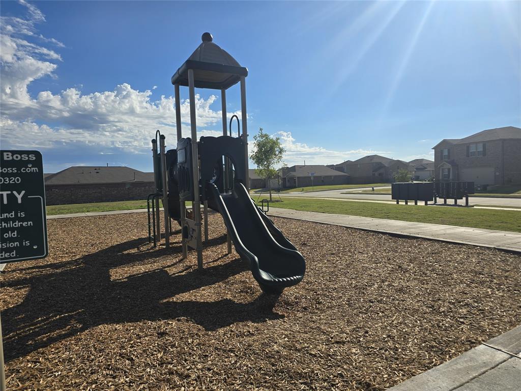 14017 Ilderton Street Pilot Point, TX 76258 - Photo 19 of 22 a view of a swimming pool with a bench and a lake view