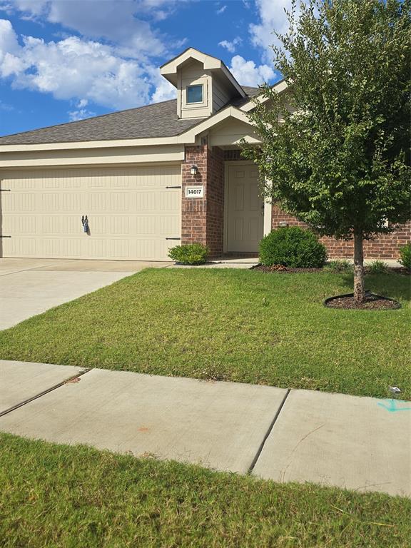 14017 Ilderton Street Pilot Point, TX 76258 - Photo 2 of 22 a front view of a house with garden
