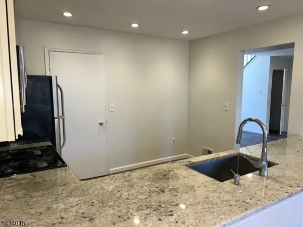 a view of a refrigerator in kitchen