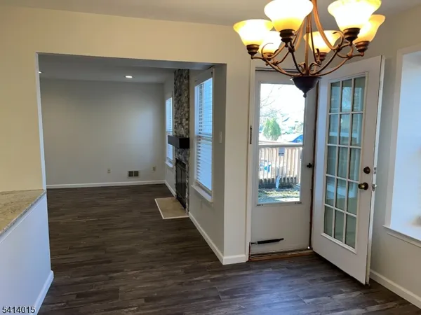 a view of entryway with wooden floor