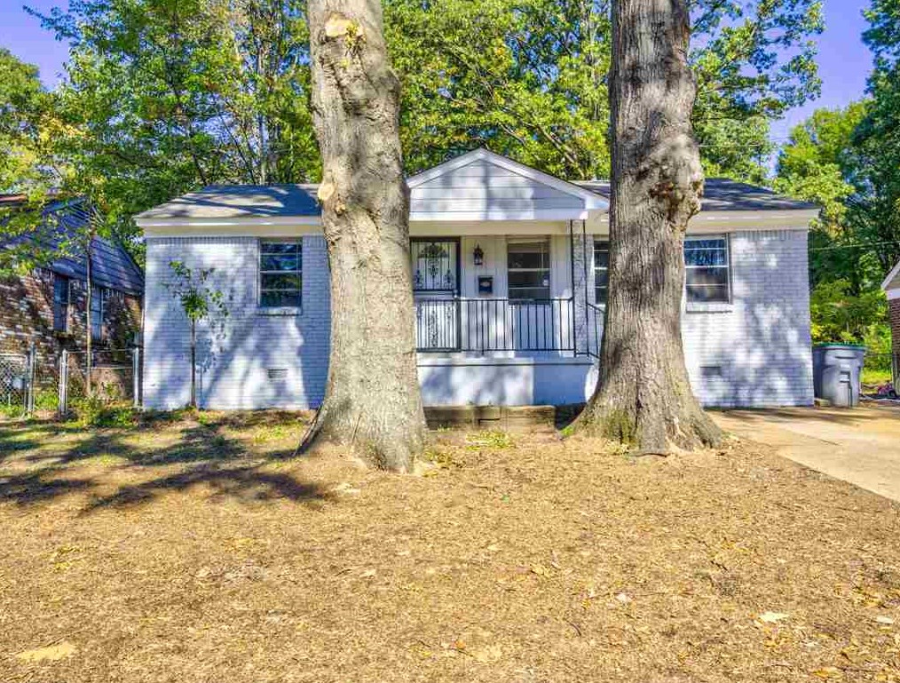 3574 Carrington Road Memphis, TN 38111 - Photo 1 of 22 a backyard of a house with barbeque oven table and chairs