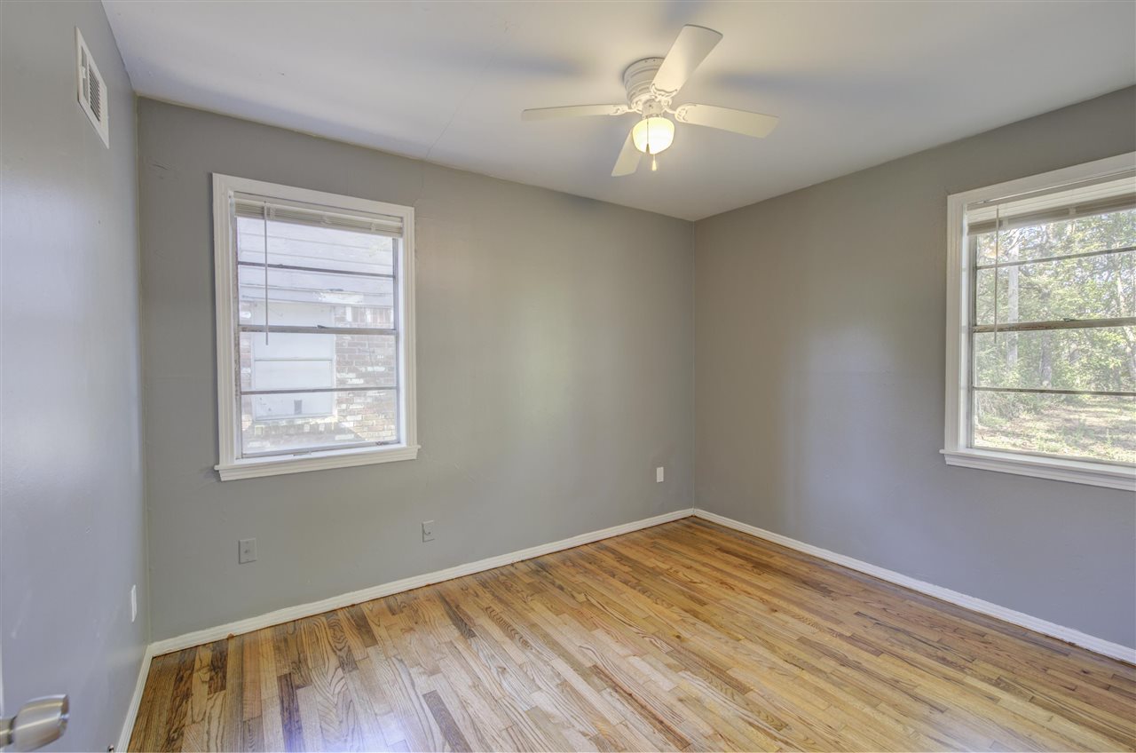3574 Carrington Road Memphis, TN 38111 - Photo 13 of 22 a view of empty room with wooden floor and fan