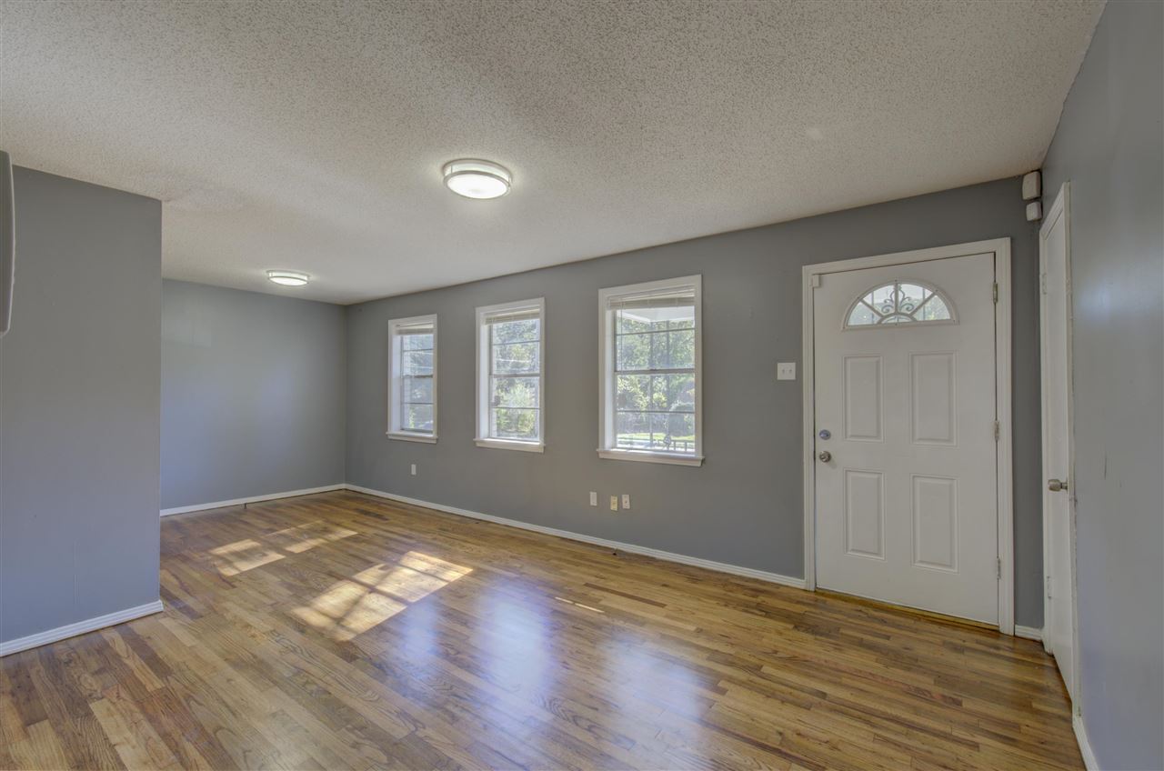 3574 Carrington Road Memphis, TN 38111 - Photo 4 of 22 a view of empty room with wooden floor and fan