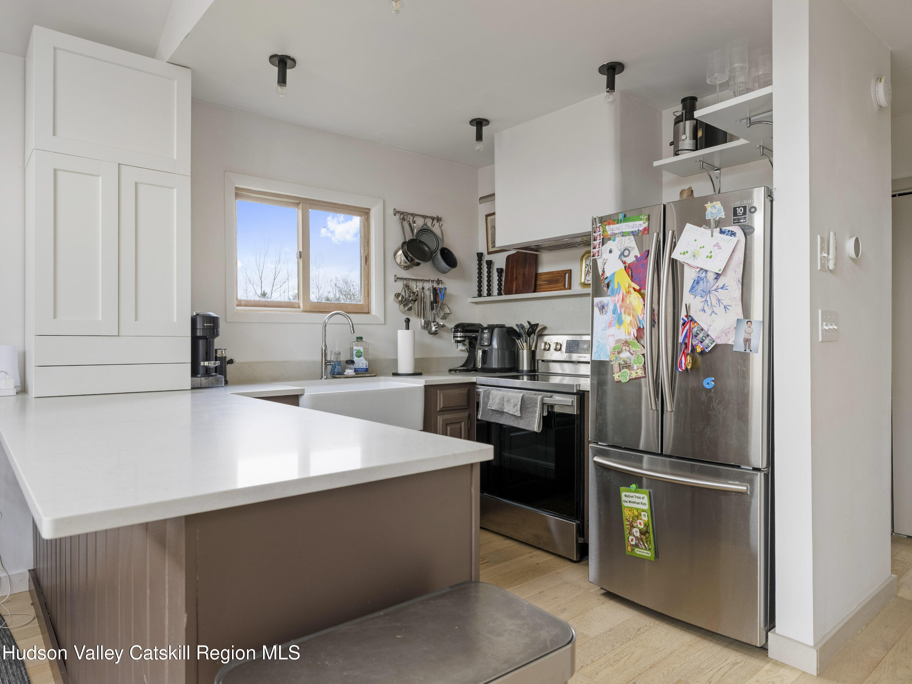 85 Bobillen Road Jewett, NY 12444 - Photo 14 of 59 a kitchen with stainless steel appliances and white cabinets